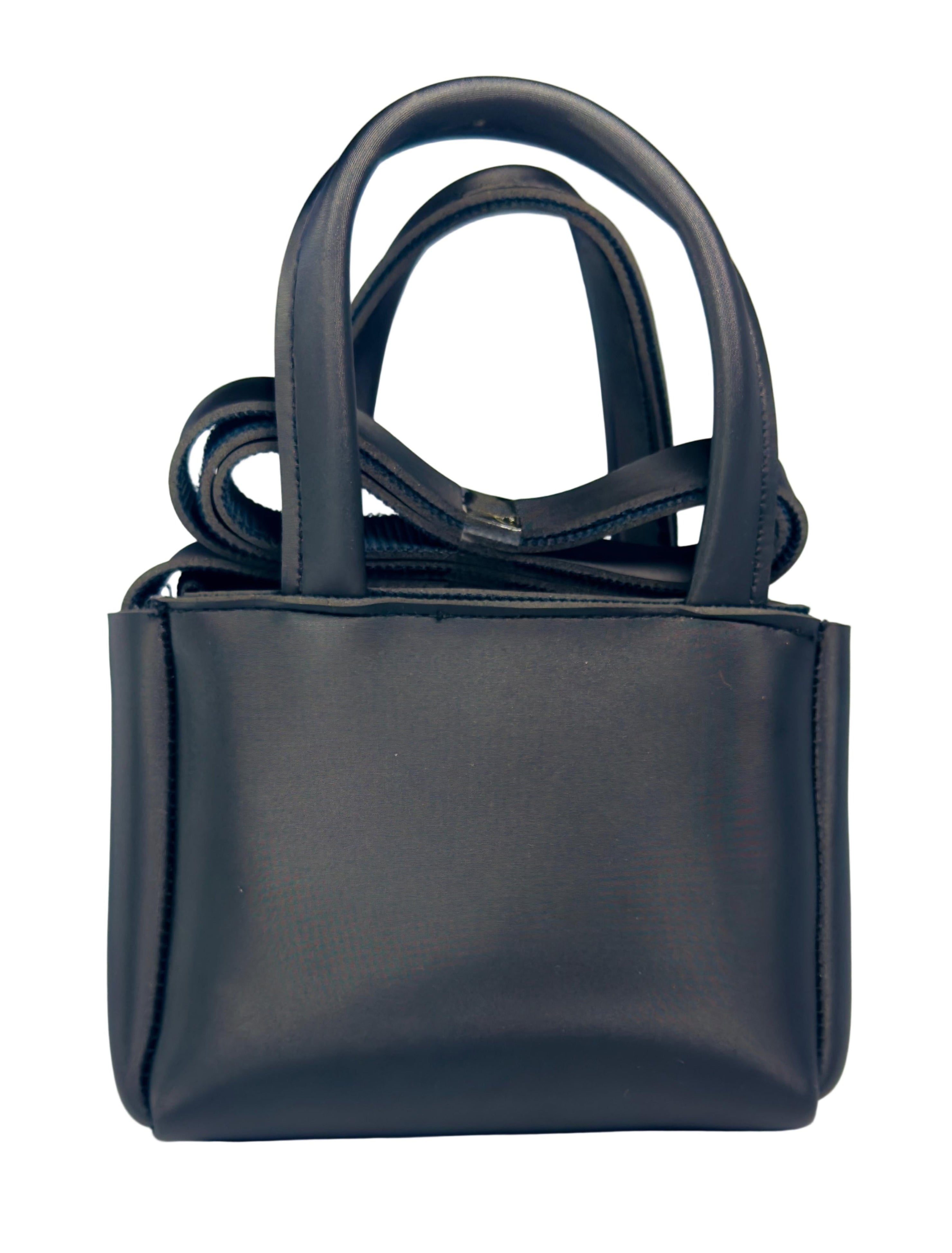 Black handbag on a light gray background
