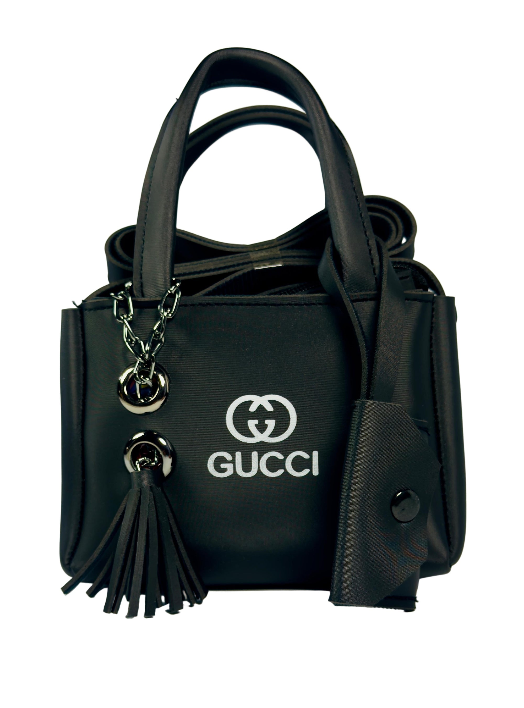 Black Gucci handbag with tassels on a white background