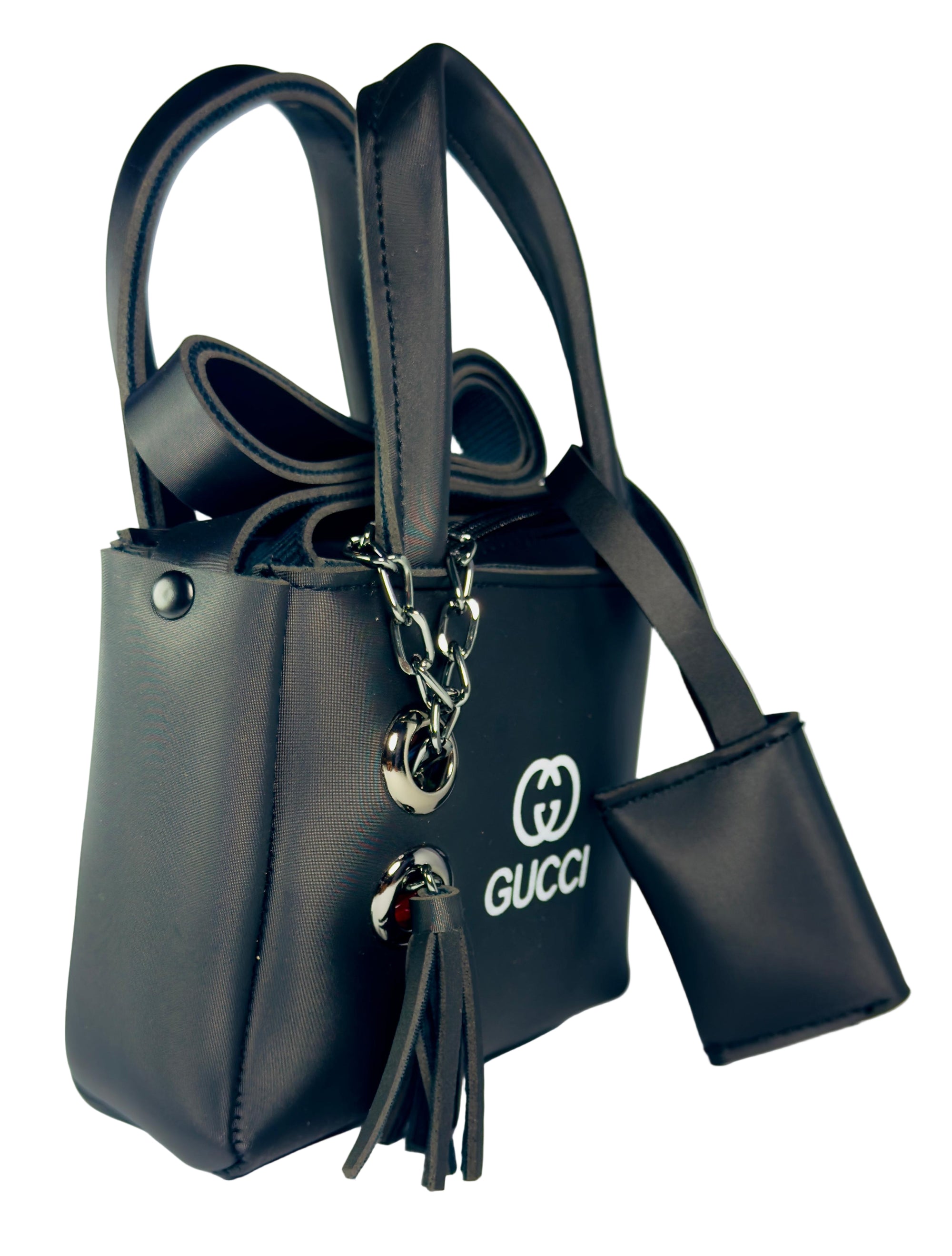 Black handbag with a keychain featuring the Gucci logo on a light gray background