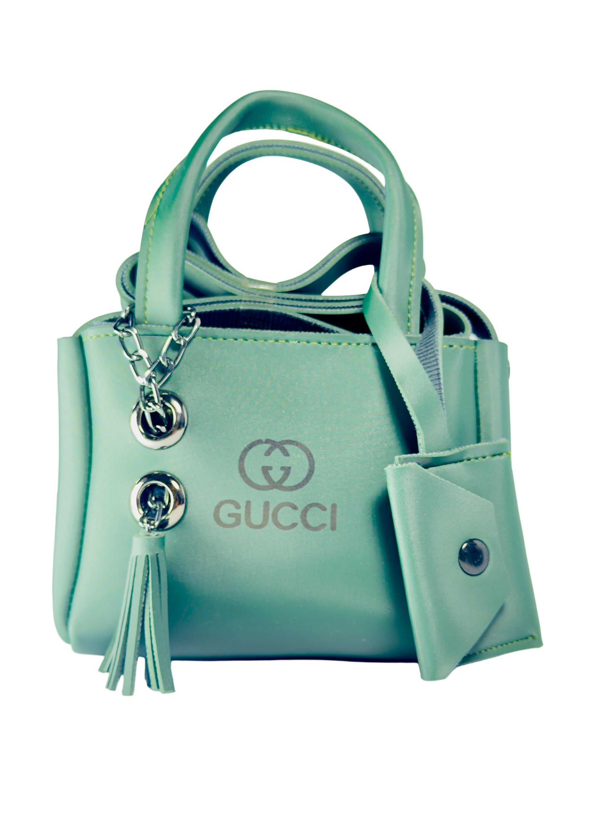 Mint green Gucci handbag with keychain on a white background