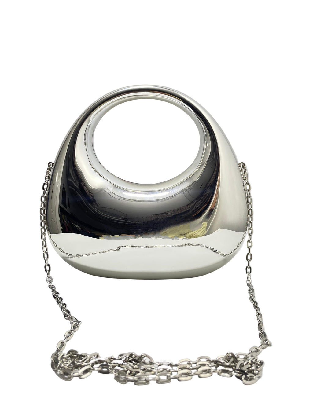 Silver handbag with chain strap on a white surface